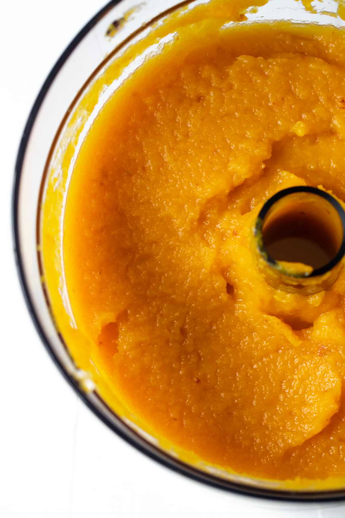 smooth pumpkin puree in a food processor container