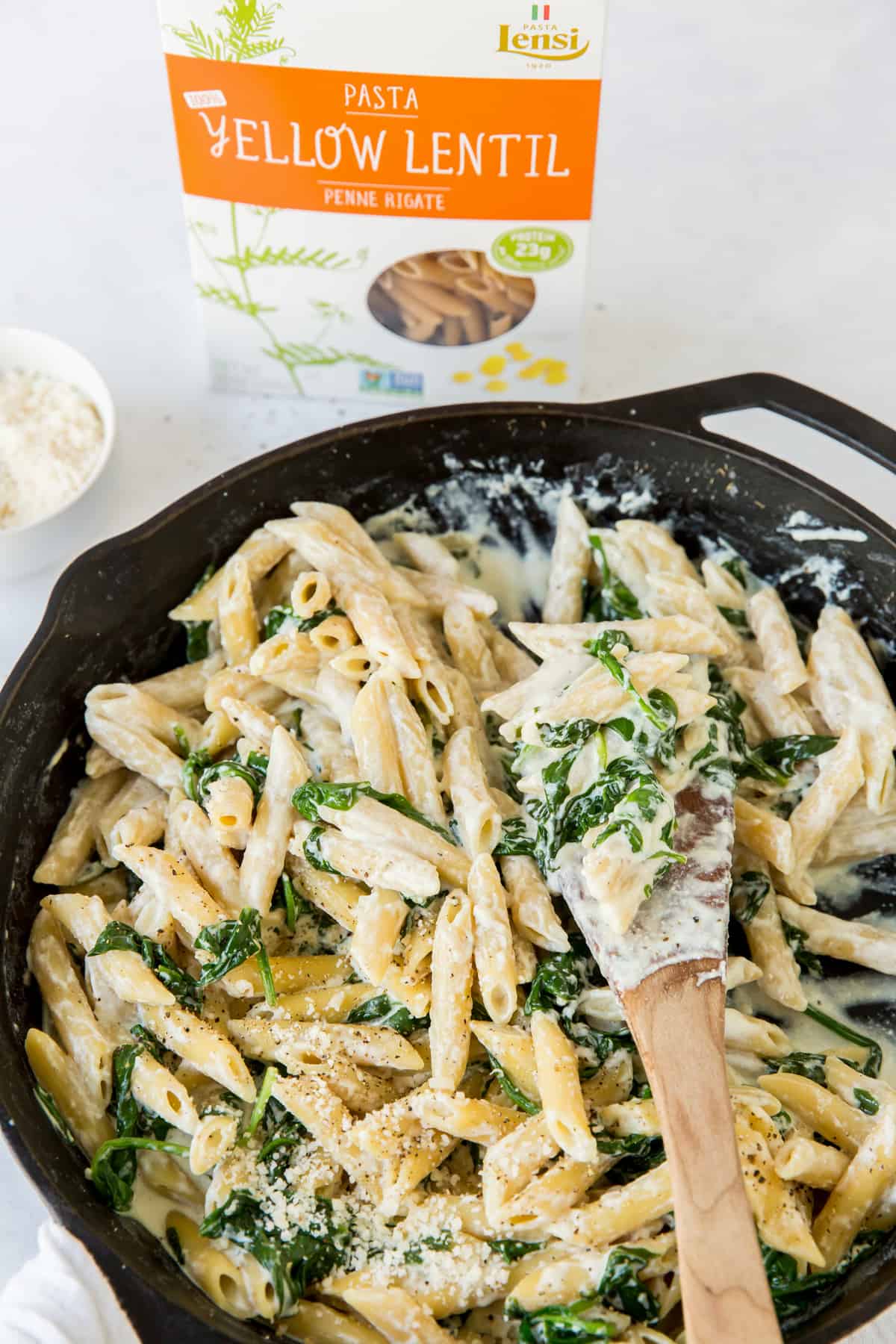 a skillet with spinach and ricotta pasta