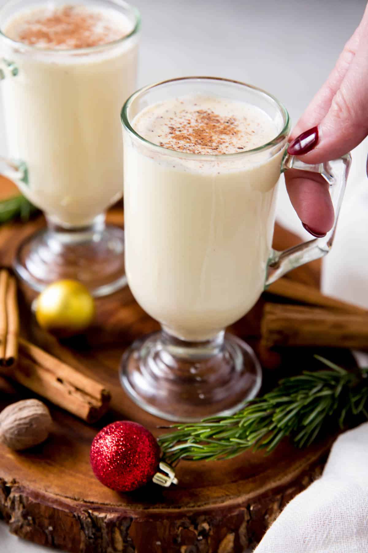 two glasses filled with homemade eggnog