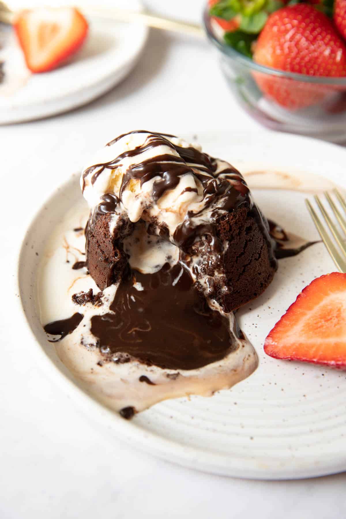 a bite taken out of a chocolate molten lava cake