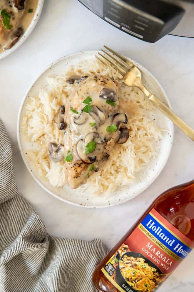 chicken marsala on a plate with rice