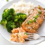 A plate with flaky teriyaki salmon, rice and broccoli