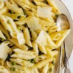 a plate of lemon pasta with peas