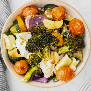roasted vegetables with feta in a bowl