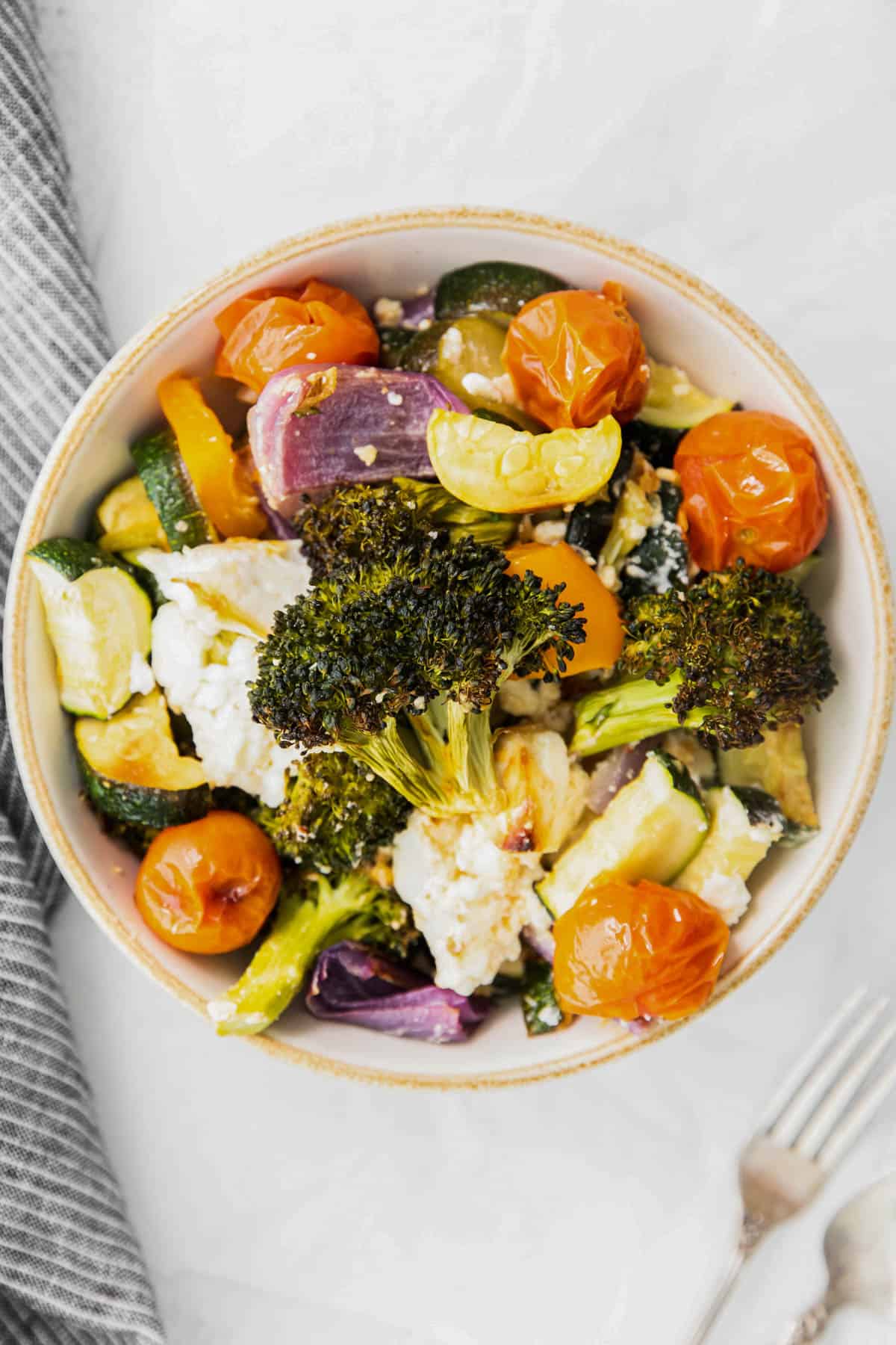 roasted vegetables with feta in a bowl