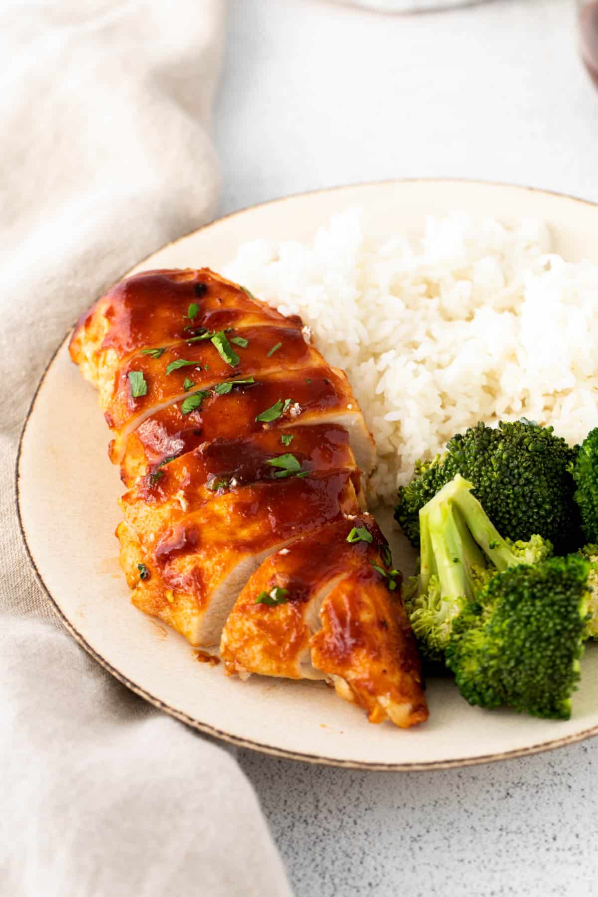 air fryer bbq chicken on a plate with rice and broccoli