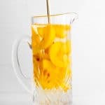 mixing together ingredients in a pitcher