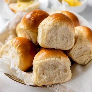 a plate filled with homemade fluffy dinner rolls