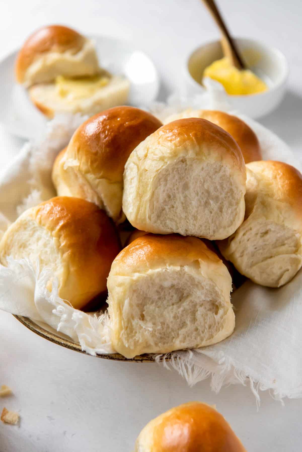 a plate filled with homemade fluffy dinner rolls