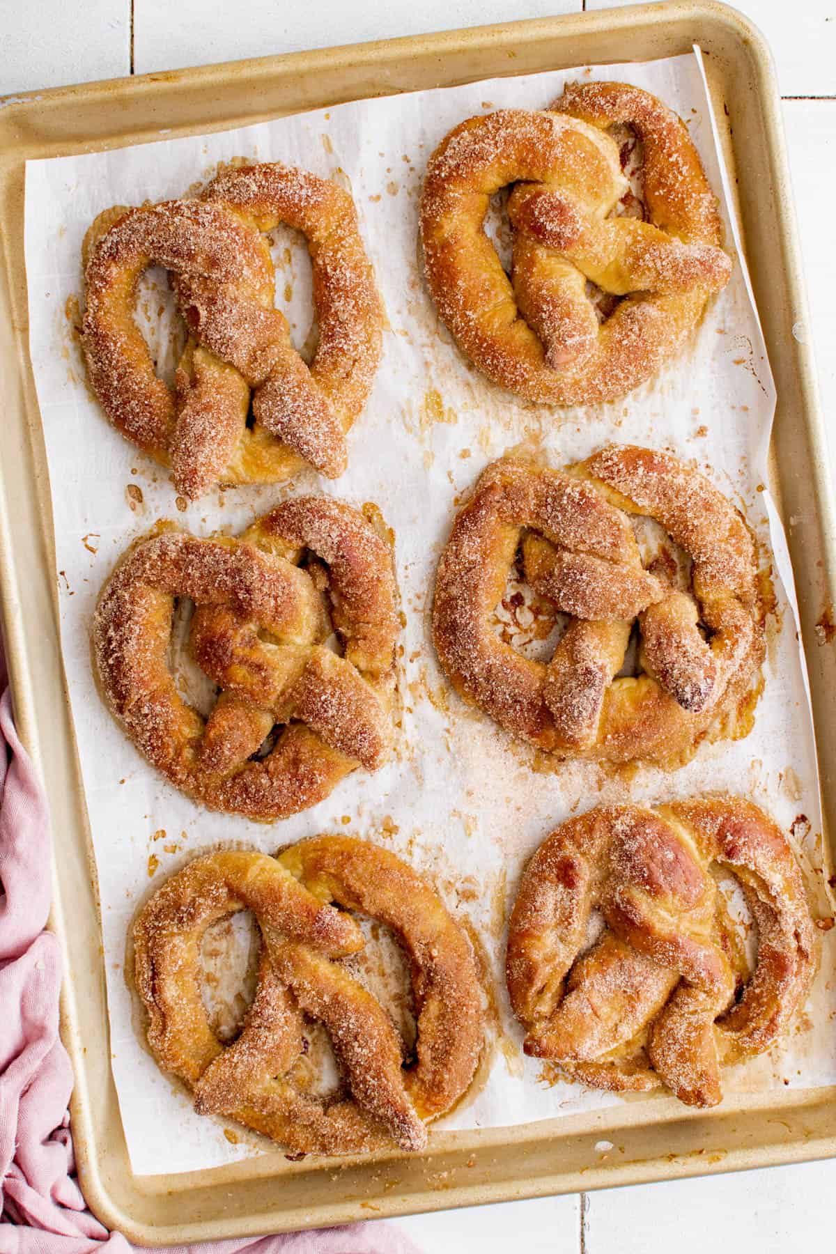 stuffed pretzels on a baking sheet after baking