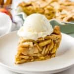 slice of apple pie with a scoop of ice cream on top