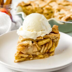 slice of apple pie with a scoop of ice cream on top