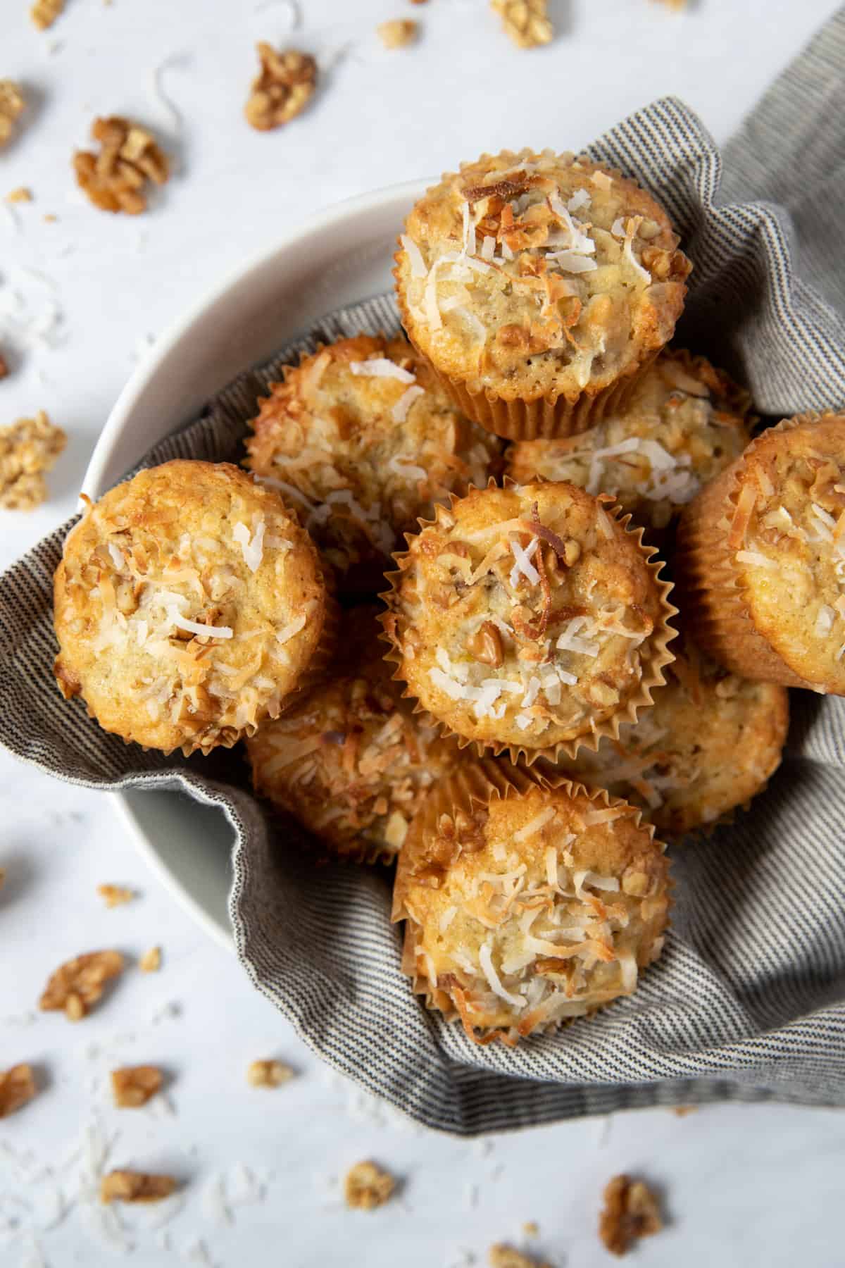 a bowl filled with banana coconut muffins