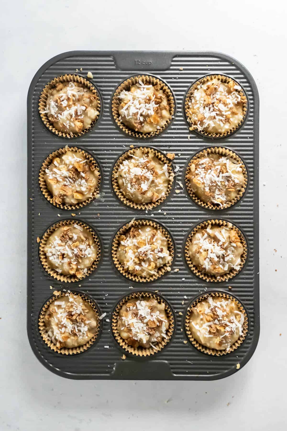 muffin batter in the muffin tin before baking