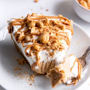 one slice of peanut butter pie with a fork in it