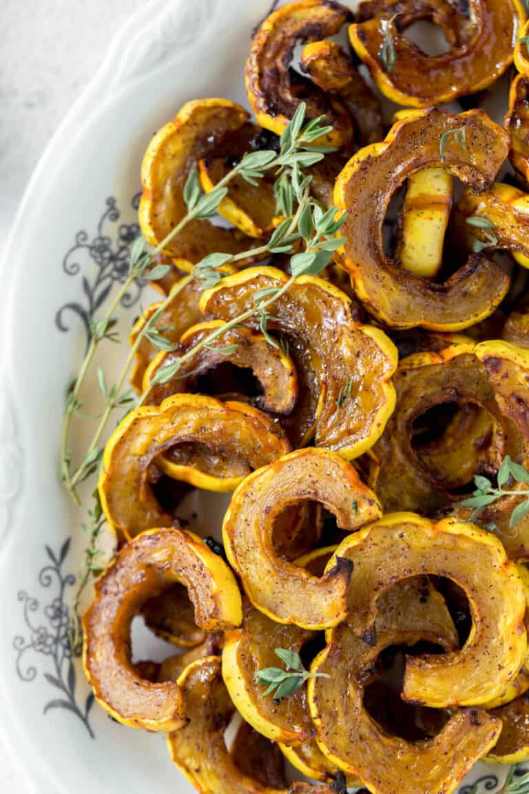 roasted delicata squash on a serving dish