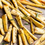 roasted parsnips on a baking sheet