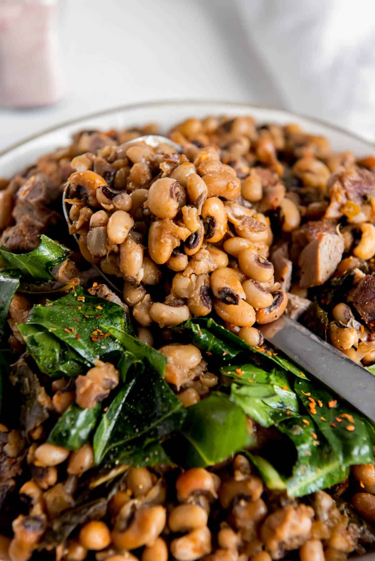 cooked instant pot black eyed peas with a spoon