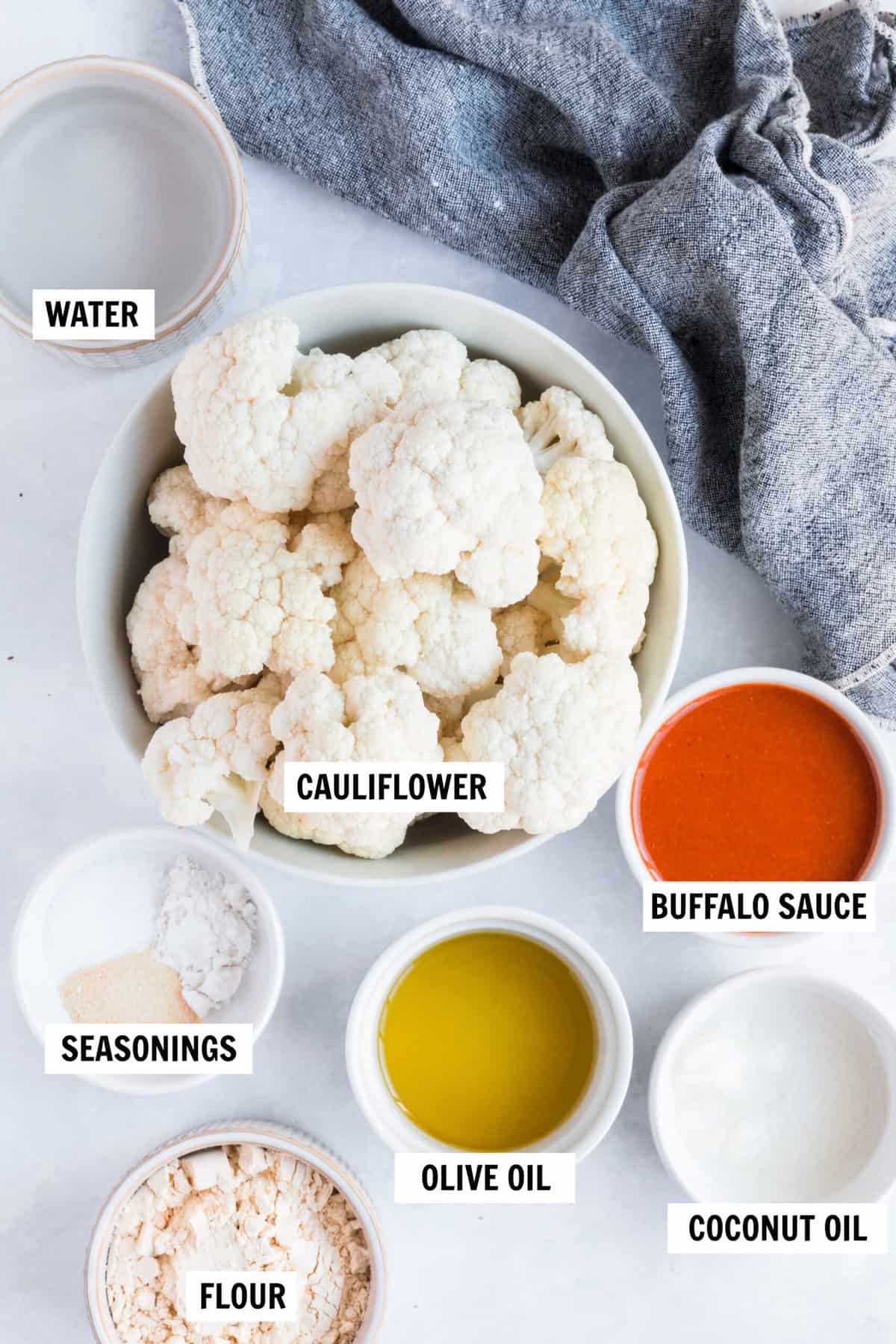 all of the ingredients for buffalo cauliflower on a countertop