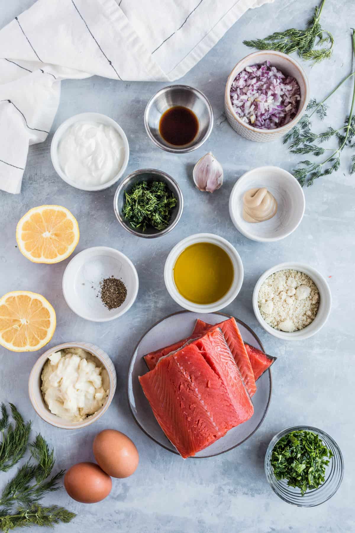 all of the ingredients for salmon patties on a countertop.