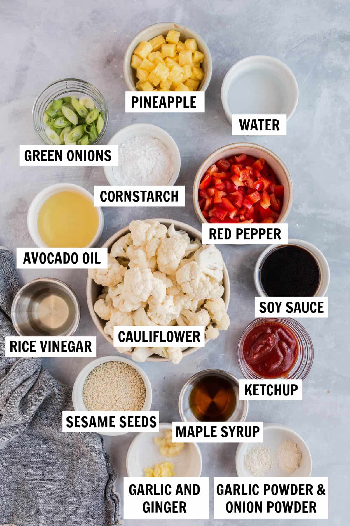 all of the ingredients for sweet and sour cauliflower in bowls on a countertop