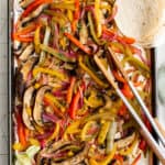 Portobella mushroom fajitas cooked on a sheet pan.