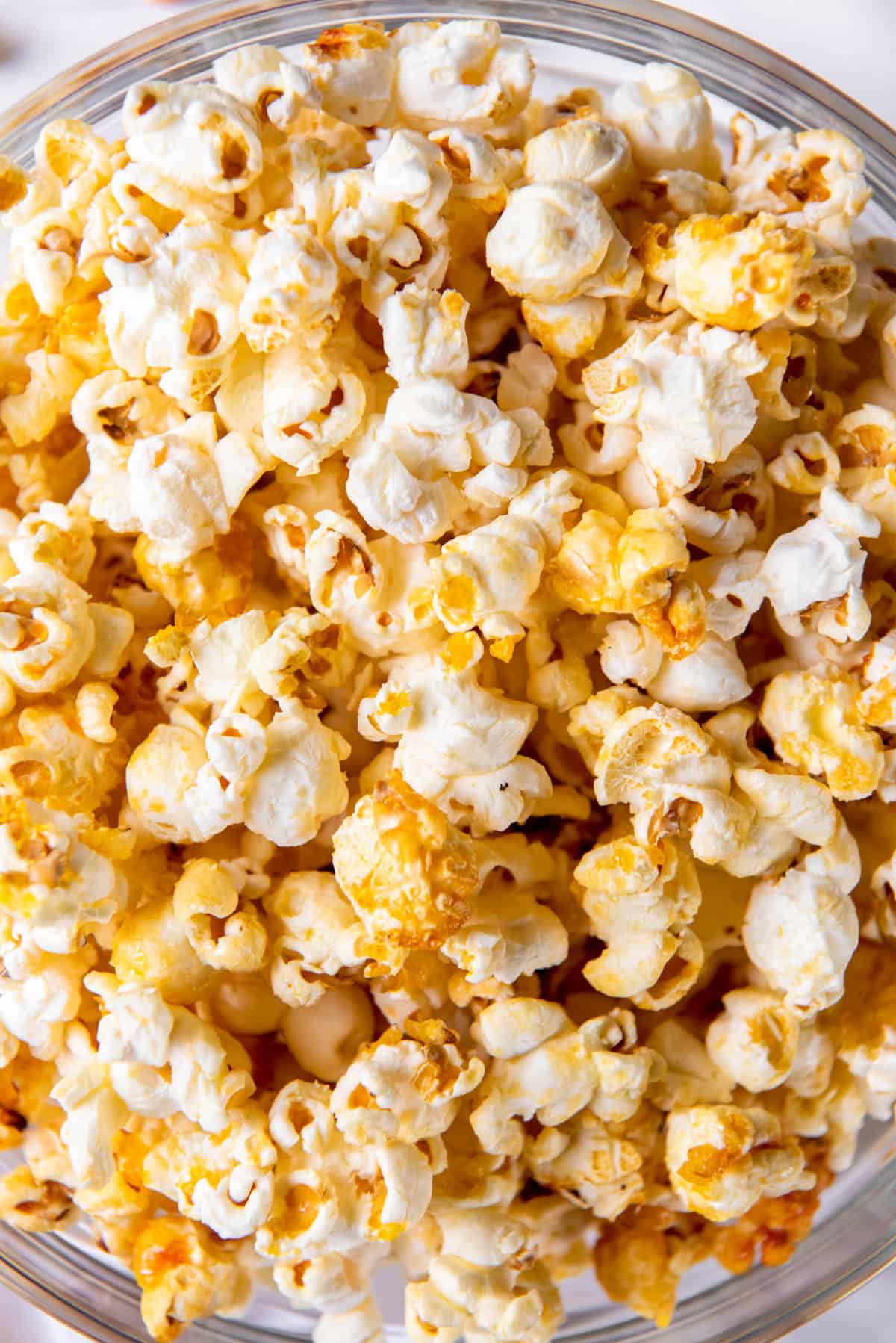 A zoomed in photos of sweet salty popcorn in a bowl. 