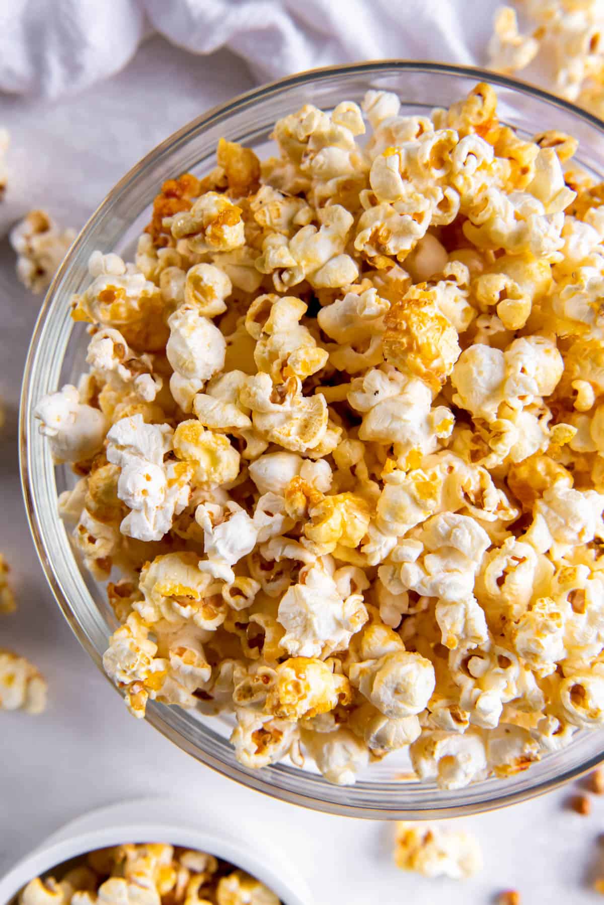 A large clear bowl filled with sweet and salty popcorn.