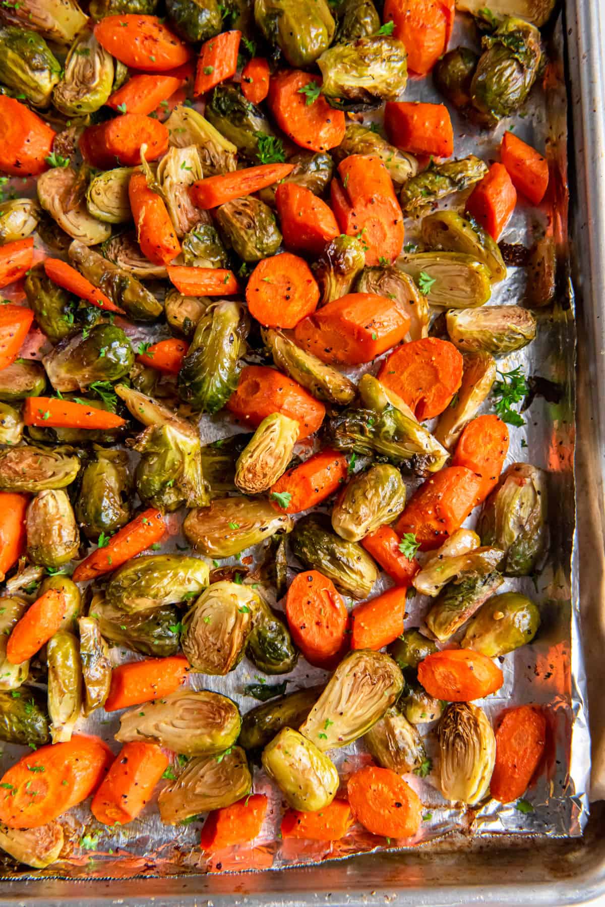 Roasted Brussels Sprouts and Carrots on a sheet pan right out of the oven.