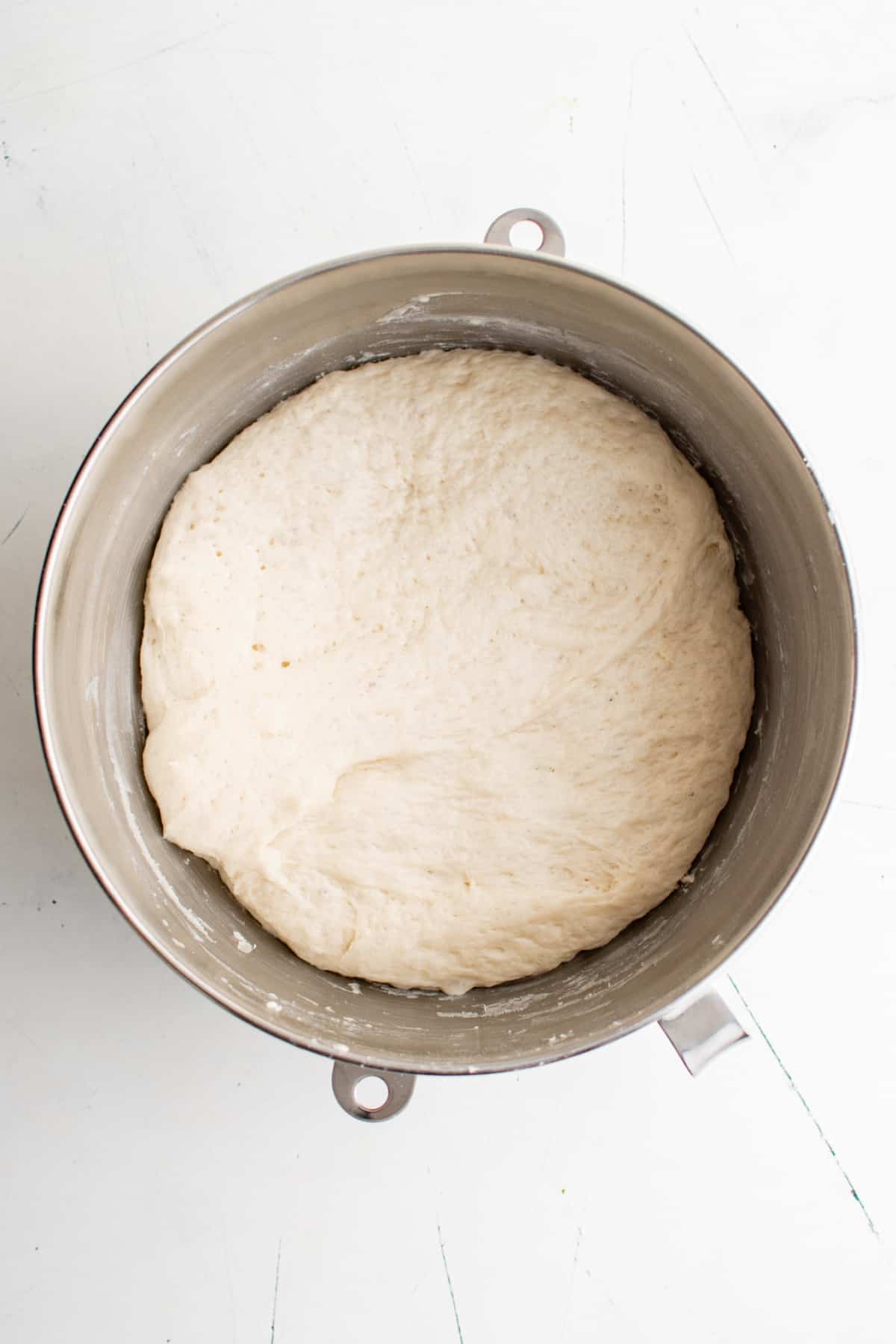 Homemade dough in a bowl after rising.