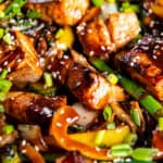 Teriyaki salmon stir fry ready to be served out of a pan.