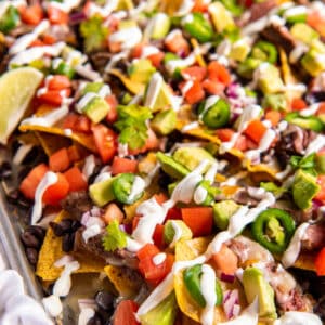 Chips layered with black beans, cooked steak, tomatoes, onions, jalapeno and avocado.