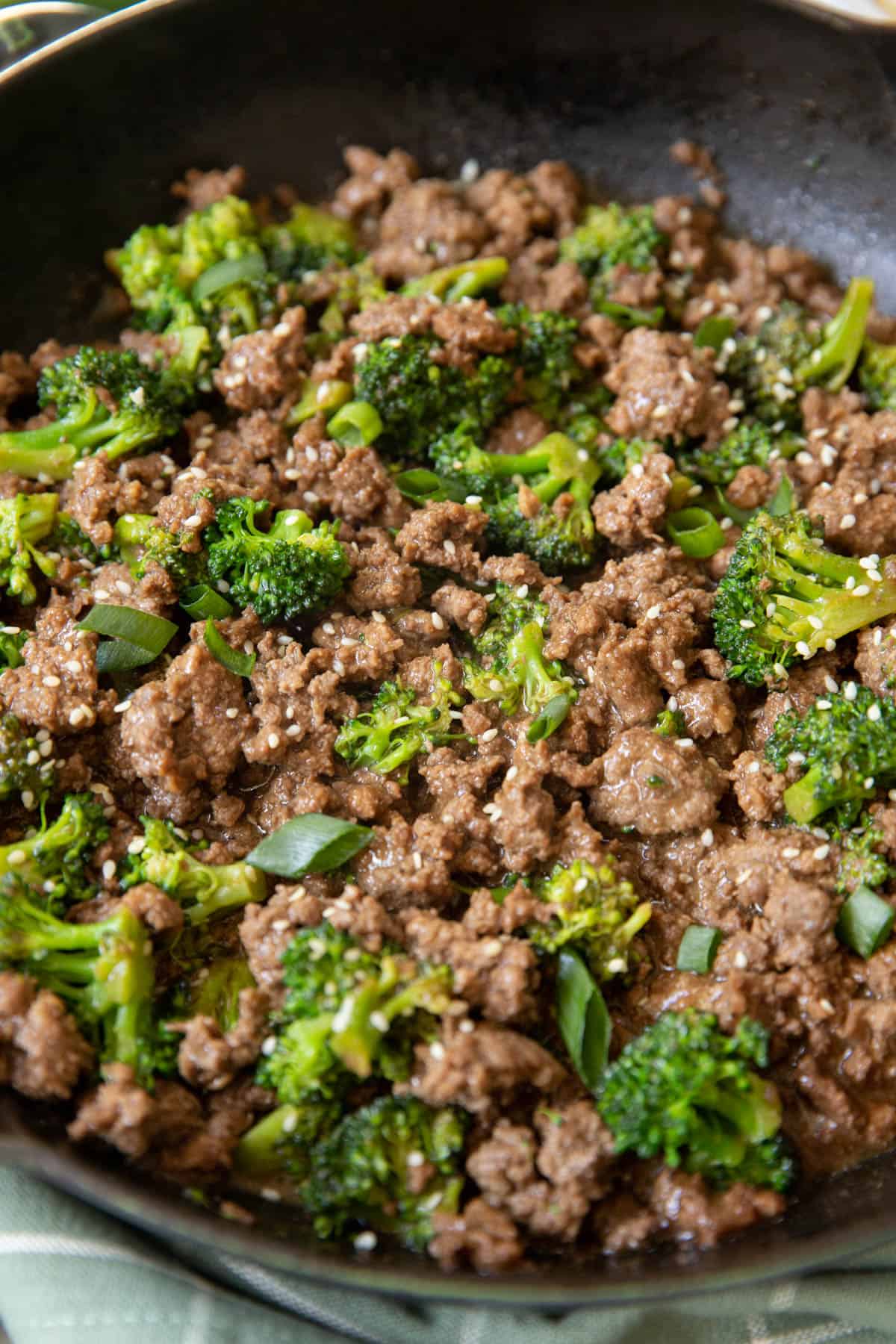 Cooked ground beef and broccoli in a skillet ready for serving.