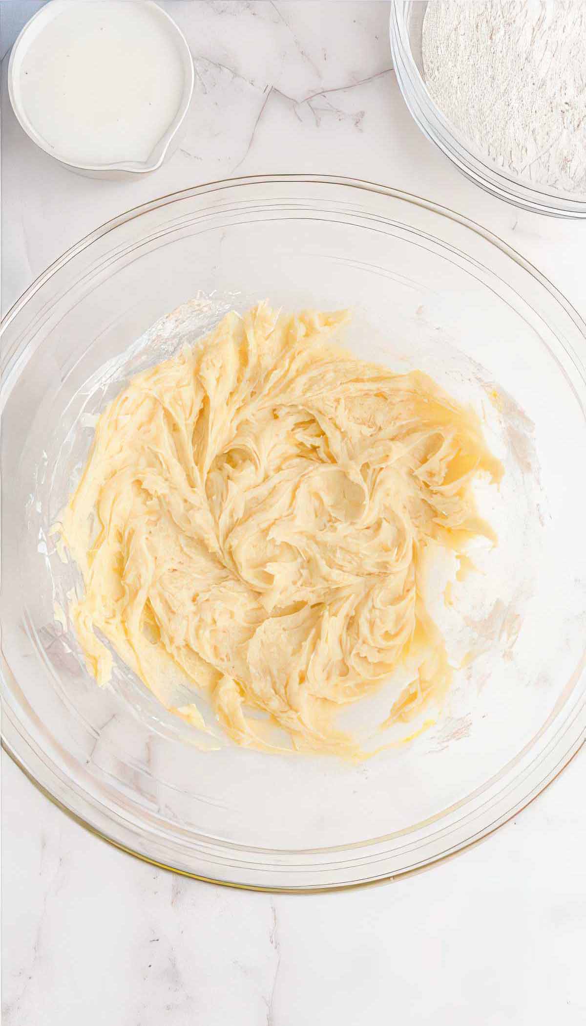 Butter, sugar, and lemon zest creamed together for buttermilk blueberry breakfast cake.