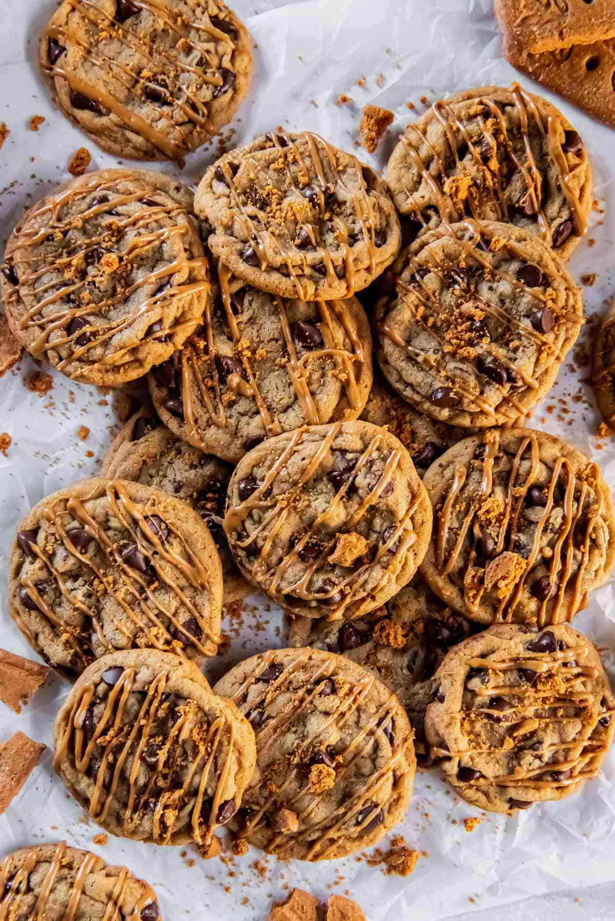 tray of warm chocolate chip cookie butter cookies cooling on parchment paper.