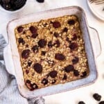 Baked blackberry baked oatmeal in a square baking dish before going into the oven