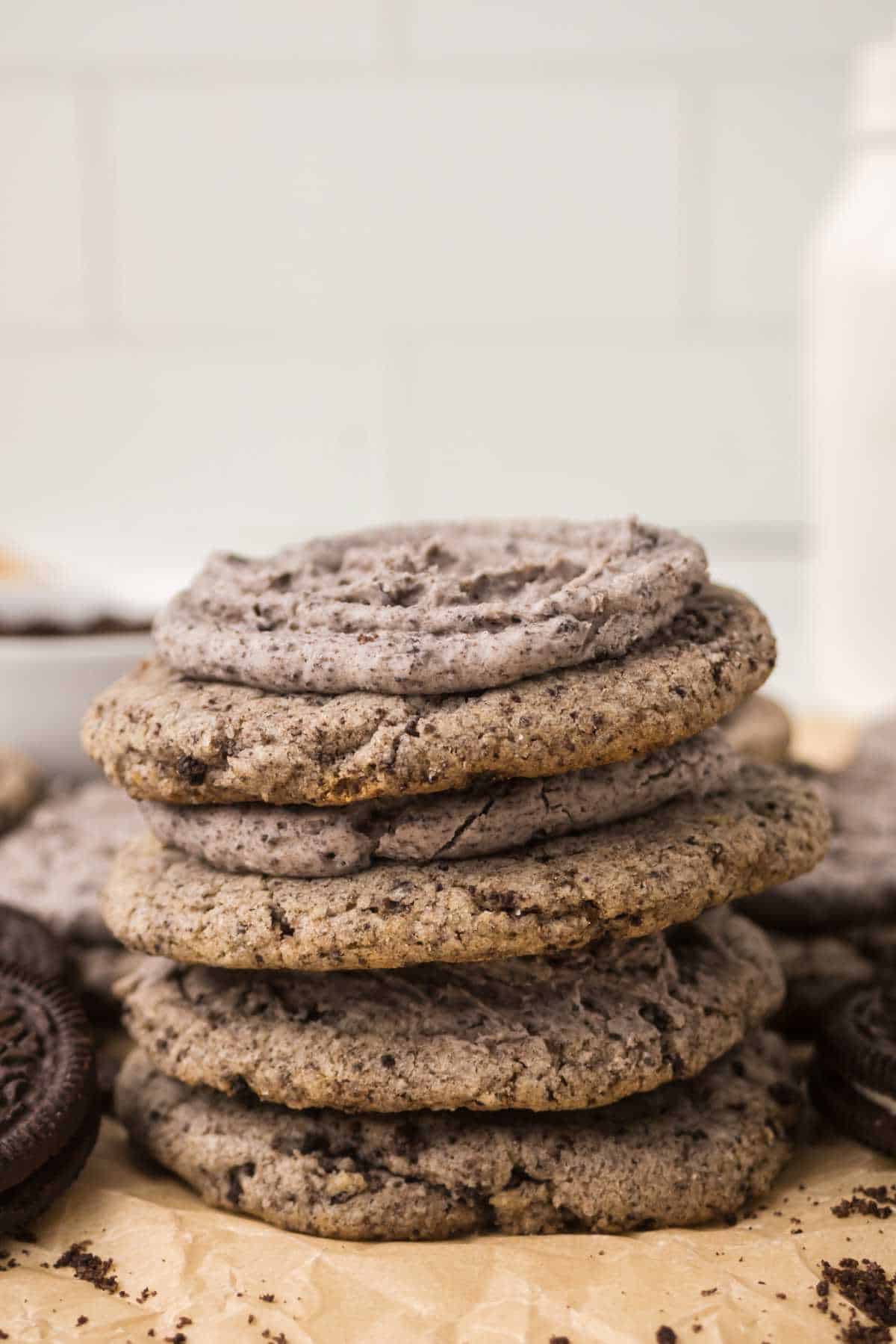 Stack of soft and chewy Oreo Milkshake Cookies with cookies-and-cream frosting.