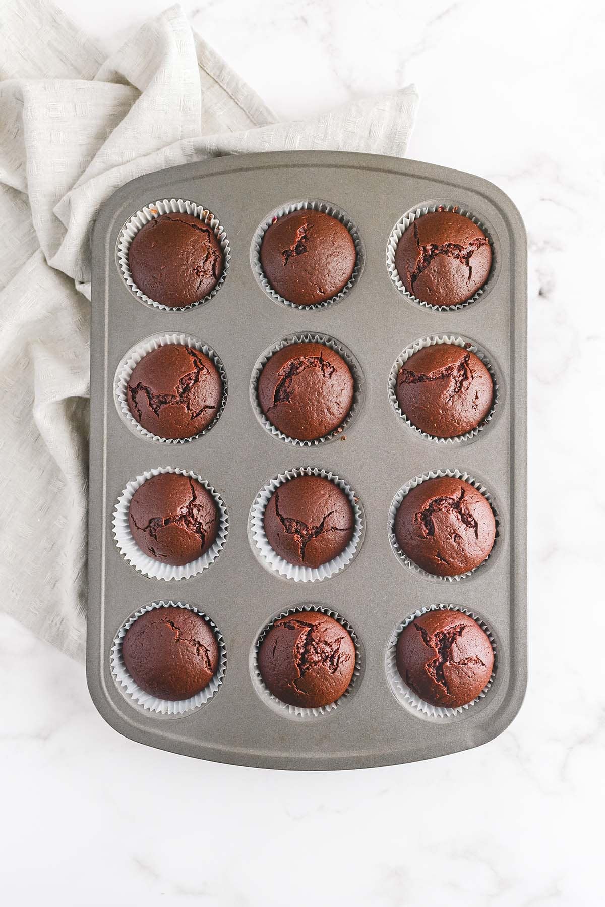 Freshly baked chocolate cupcakes in a muffin pan