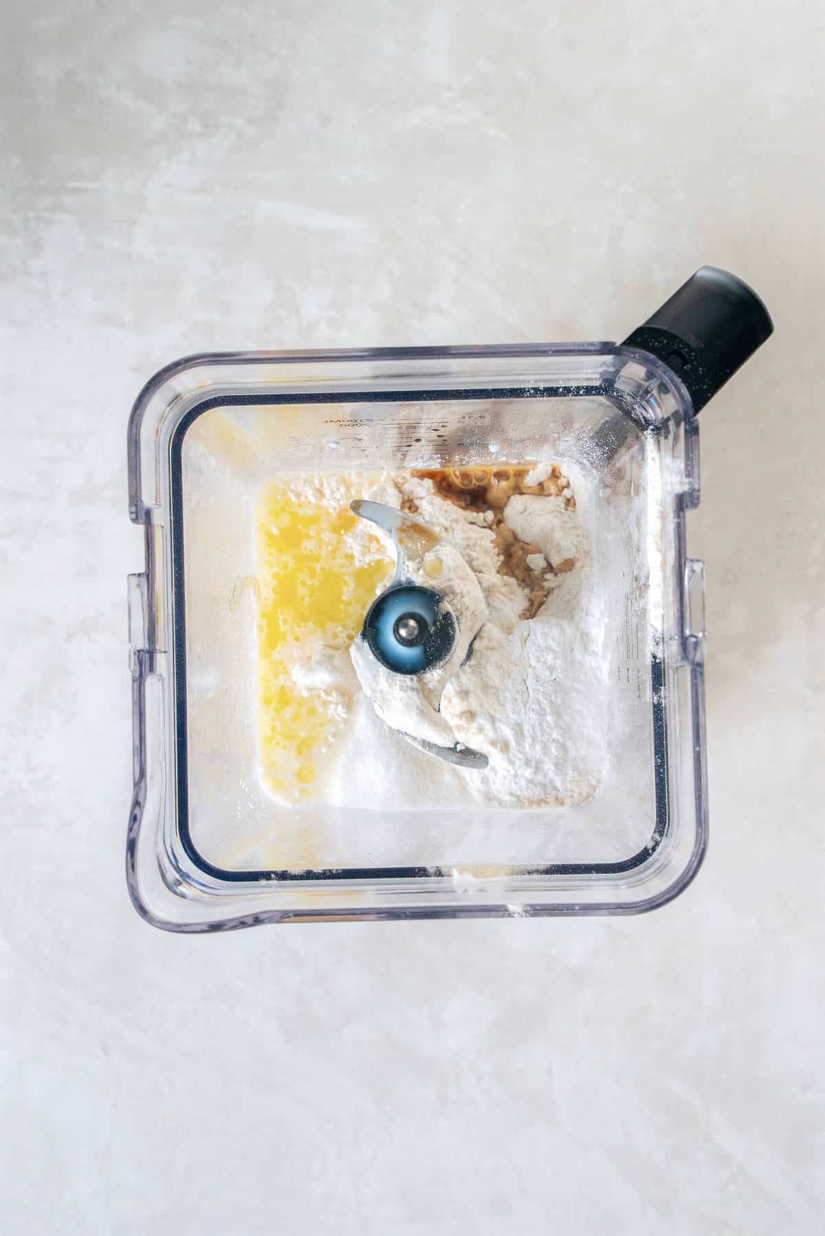 Ingredients for pancake roll ups added to a blender before mixing into batter