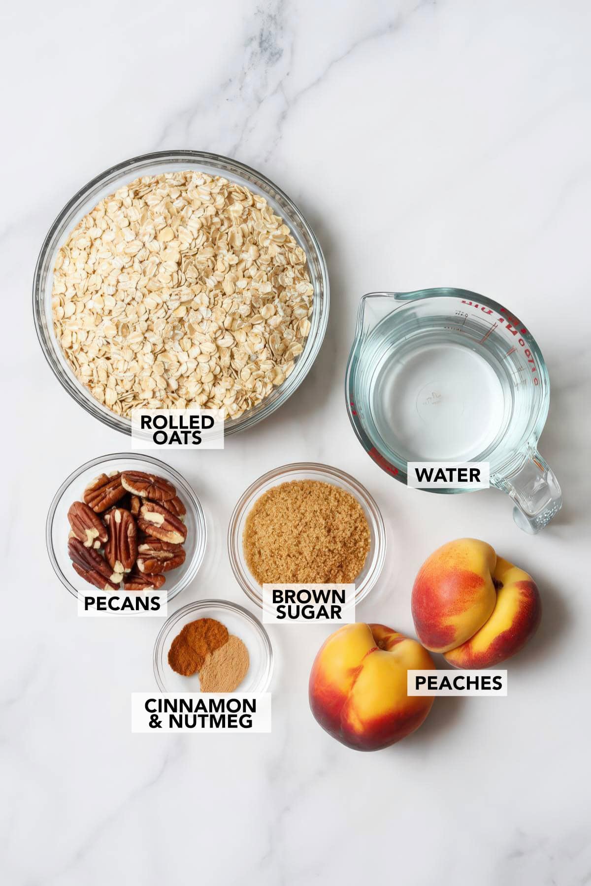 Ingredients for peach cobbler oatmeal including oats, peaches, pecans, brown sugar, cinnamon, and water.