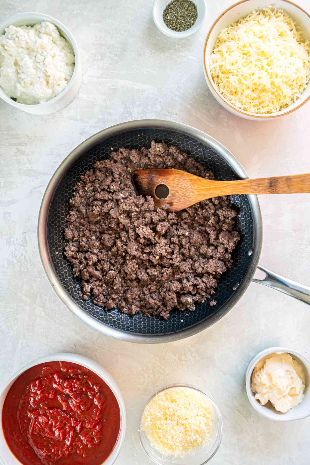 Ground beef cooked in a skillet for stuffed shells filling