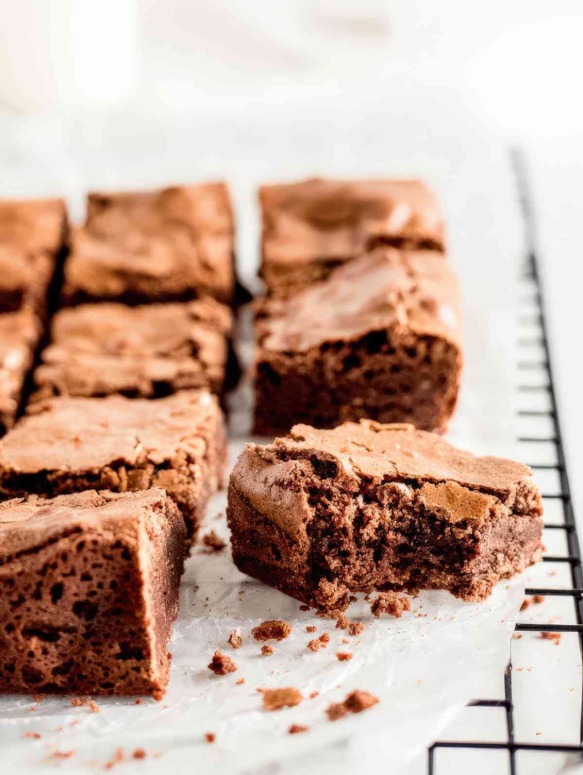 Close up of chewy brownie squares showing soft center and crackly top