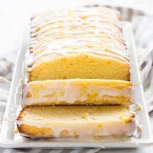 easy lemon pound cake loaf with glaze sliced and served showing soft buttery crumb