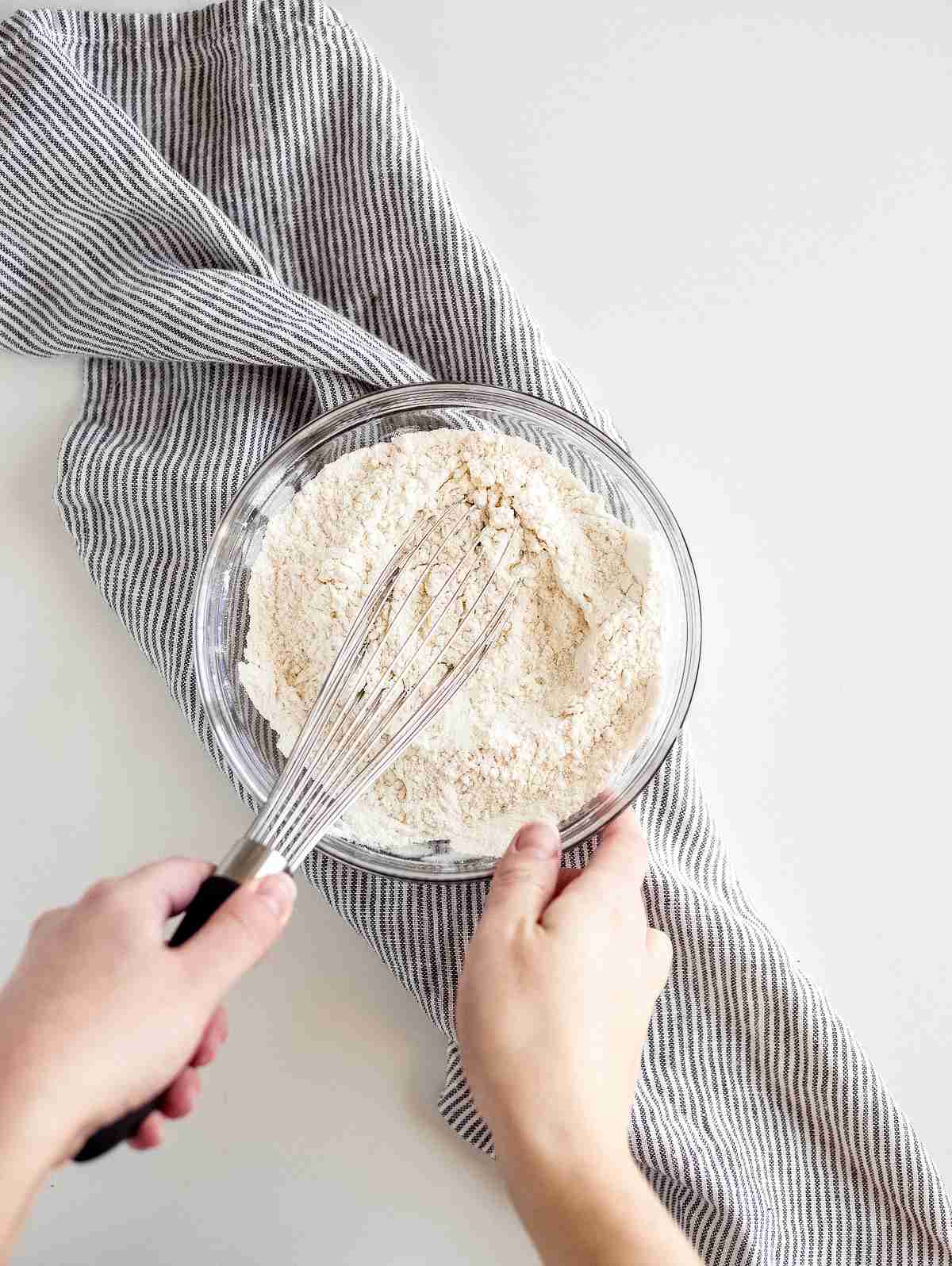 whisking flour baking powder and salt together in a bowl for lemon pound cake batter