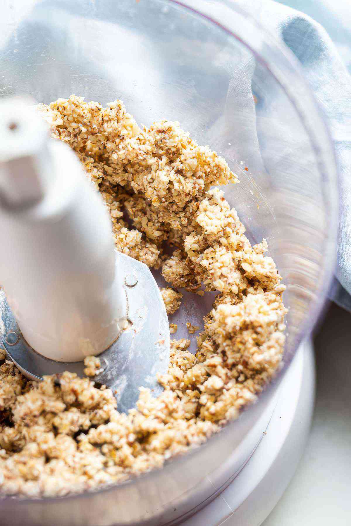 Almond oat topping mixed in a food processor until crumbly for berry almond crisp.