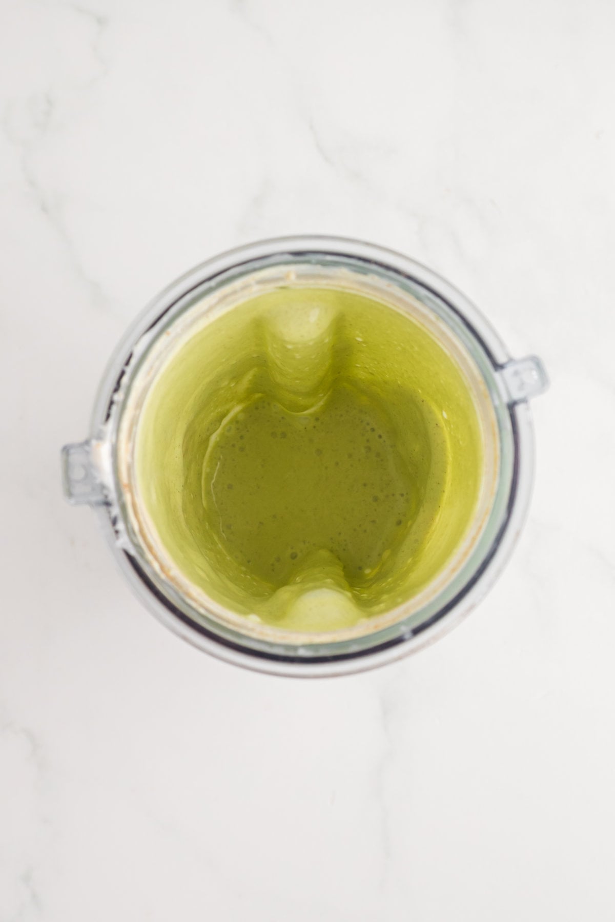 Blended jalapeño ranch sauce in a blender, smooth and creamy green dipping sauce