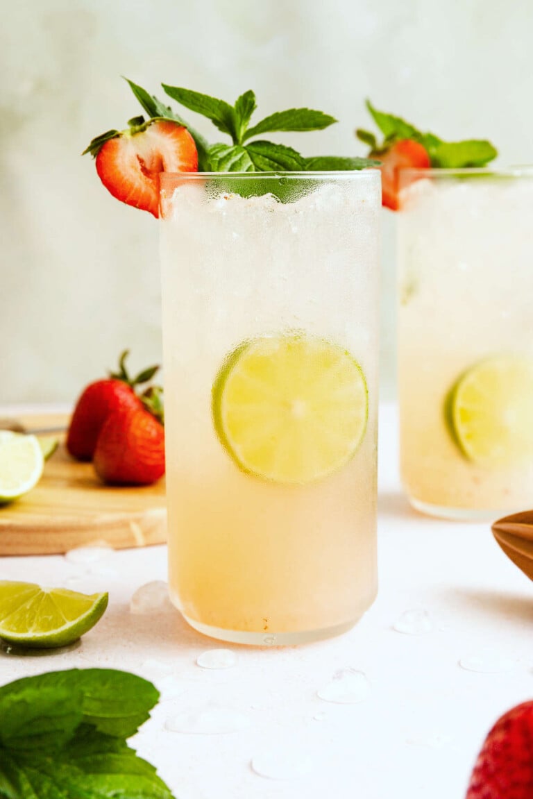 Strawberry mojito cocktail made with fresh strawberries, mint, lime juice, rum, and club soda served over ice.