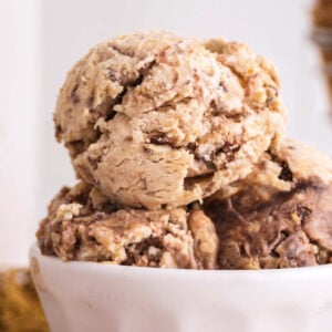 Close up of Nutty Buddy ice cream in a bowl with peanut butter ice cream, chocolate swirls and pieces of wafer bars.